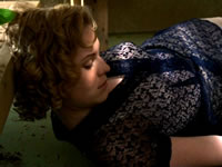 There’s a dead woman in here. Dead and cooled off. 