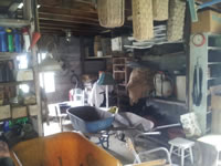 Workroom with Pola Stout's baskets hanging from the rafters.