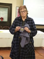 Rebecca Stout Bradbury with a scarf made from fabric designed by Pola Stout